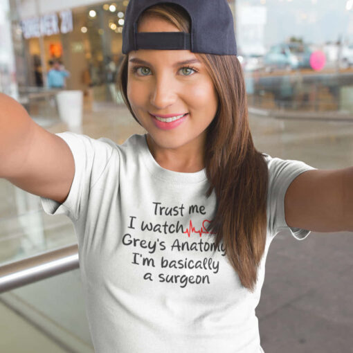 Grey's Anatomy T-shirt in White A Grey's Anatomy Trust Me t-shirt with the text "Trust me, I watch grey's anatomy" prominently displayed.