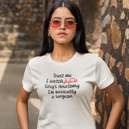 Grey's Anatomy T-shirt in White A Grey's Anatomy Trust Me t-shirt with the text "Trust me, I watch grey's anatomy" prominently displayed.