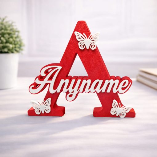 Name Letter Butterfly Personalised nursery letter name sign Any name on Red initial A with butterfly decorations, freestanding kids room décor displayed on nursery shelf with teddy bear and baby items. Available in multiple colour and adornment options.